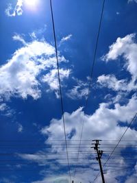 Low angle view of electricity pylon against sky