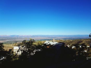 Scenic view of landscape against clear blue sky