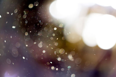 Full frame shot of raindrops on wet glass