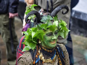 Close-up of person wearing costume in city