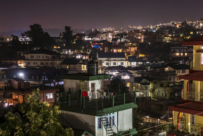 High angle view of illuminated cityscape against sky