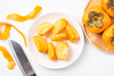 High angle view of fruits in plate on table