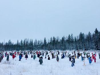 Group of people on snow covered landscape