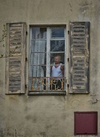 Low angle view of window on building wall