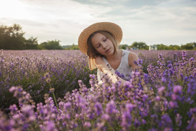 Woman with flowers on land