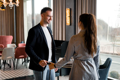 Couple standing in hotel lobby