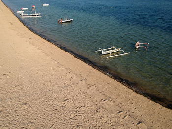 High angle view of boats moored on shore