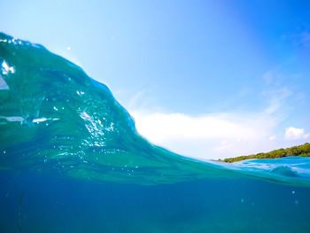 Scenic view of sea against blue sky