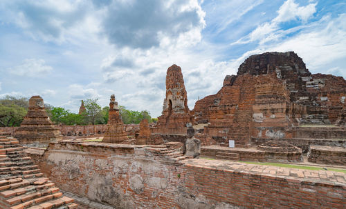 Old ruins of temple against cloudy sky
