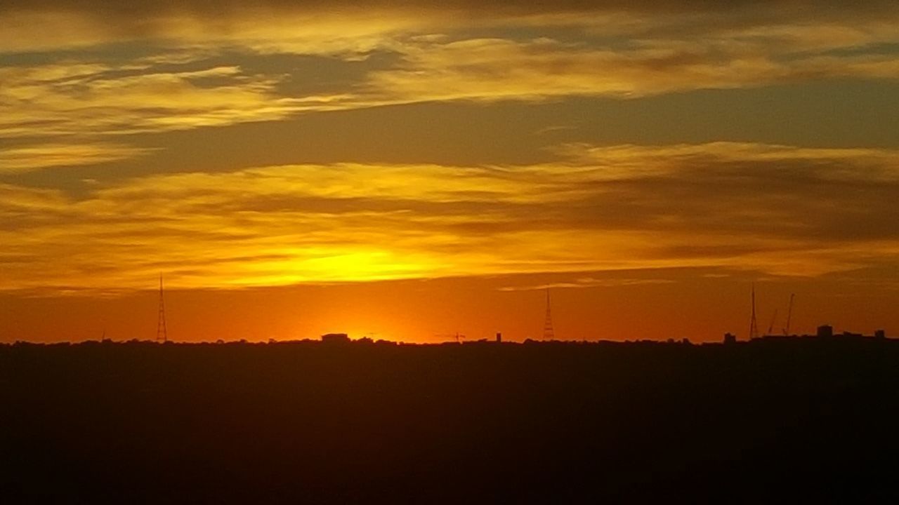 SILHOUETTE LANDSCAPE AGAINST ORANGE SKY DURING SUNSET