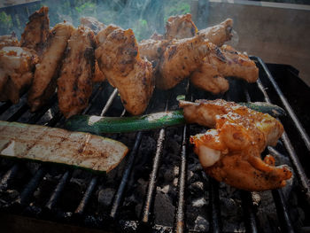 High angle view of meat cooking on barbecue grill