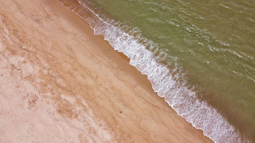 High angle view of surf on beach