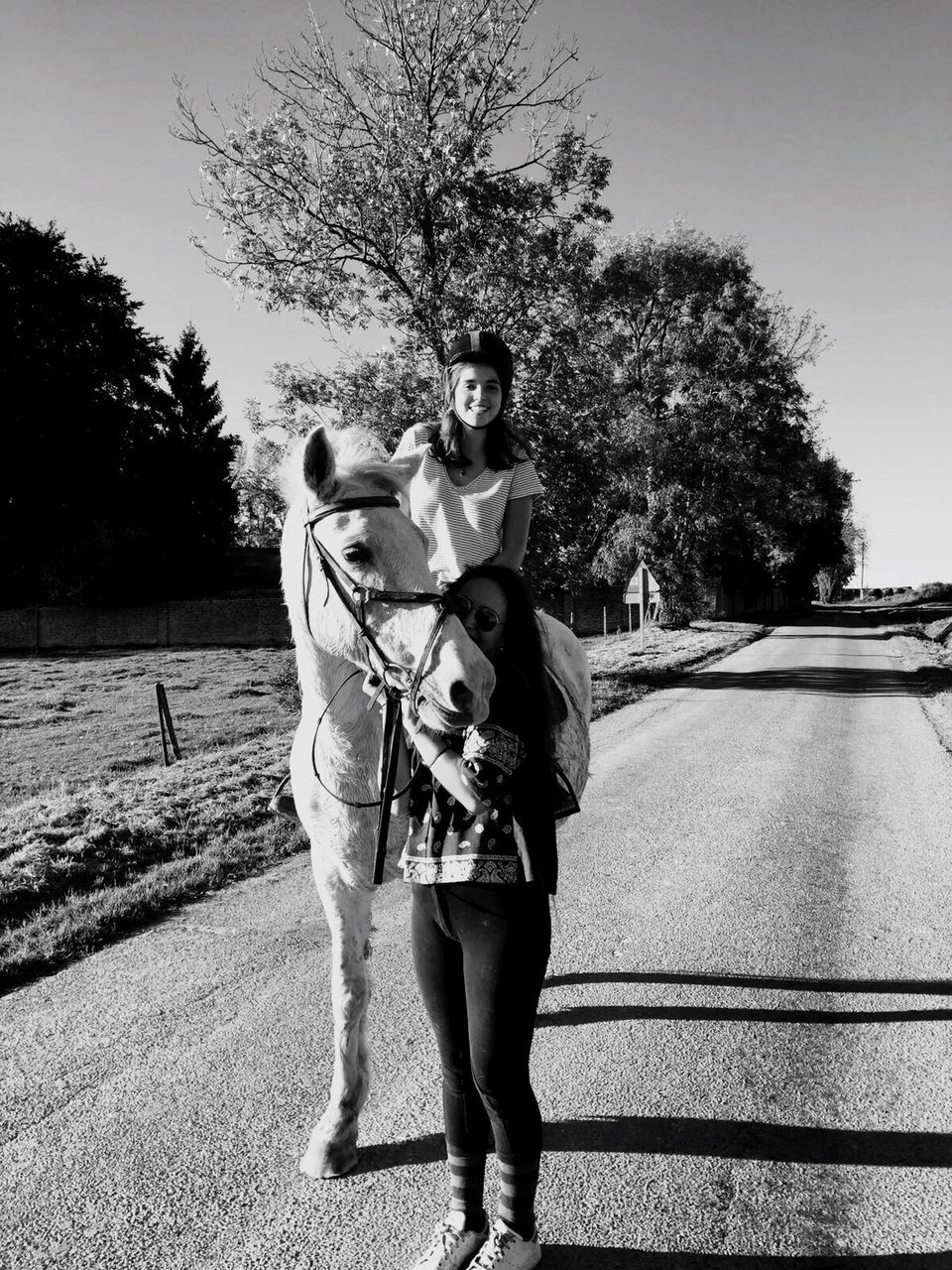 full length, two people, front view, tree, leisure activity, togetherness, walking, looking at camera, outdoors, happiness, day, young men, young adult, portrait, bonding, young women, couple - relationship, standing, smiling, real people, men, friendship, sky, mammal, adult, people