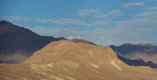 View of mountain range against cloudy sky