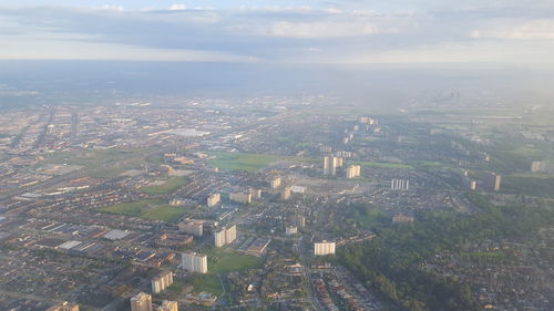 Aerial view of cityscape against sky