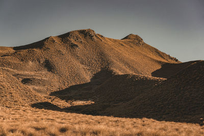 Scenic view of mountain range against clear sky