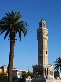 View of tower of building against blue sky