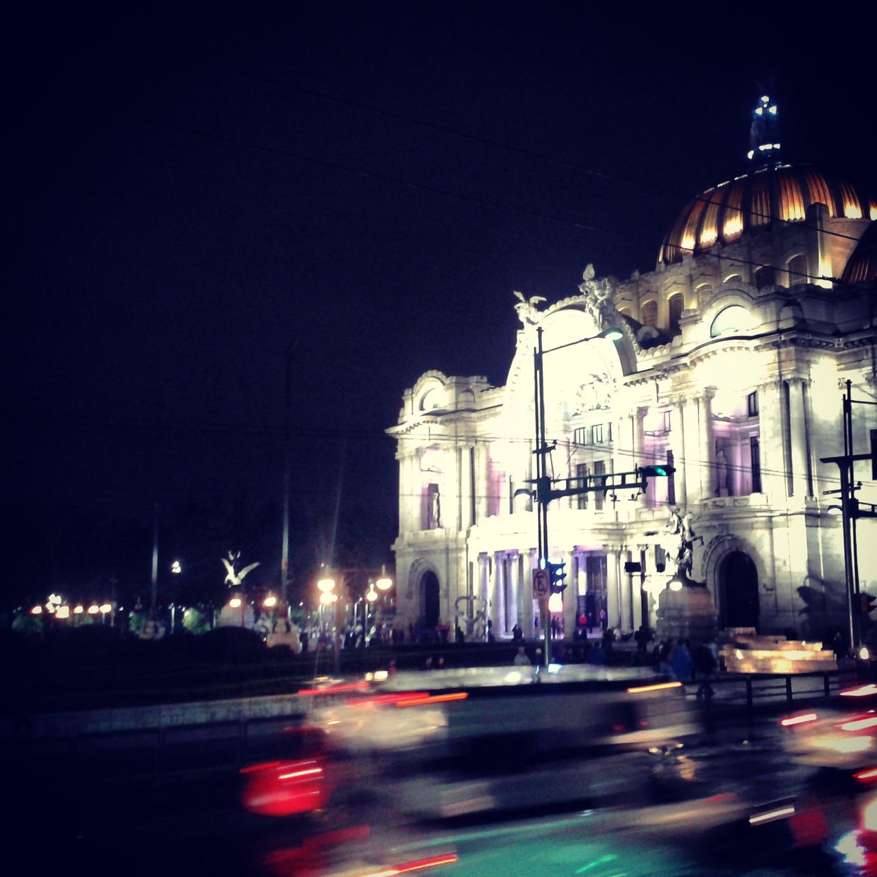 architecture, illuminated, night, built structure, building exterior, transportation, city, mode of transport, travel destinations, travel, street, famous place, city life, car, capital cities, international landmark, sky, street light, tourism, land vehicle