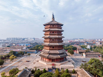 View of buildings in city against sky