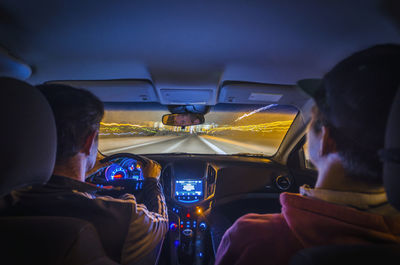 Rear view of woman driving car