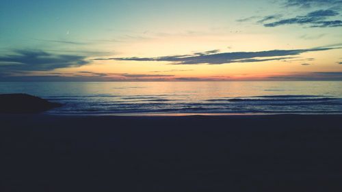 Scenic view of sea at sunset