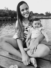 Portrait of mother and woman sitting outdoors