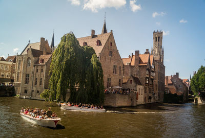 People on boat in river