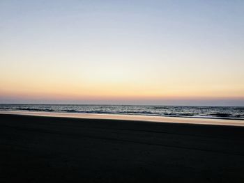 Scenic view of sea against clear sky during sunset