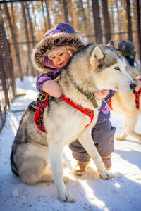 Portrait of carefree girl with dog