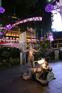 Statue of woman at night