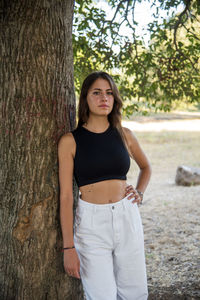 Beautiful italian girl at the park, wearing a dress