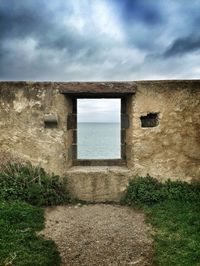 Built structure against cloudy sky