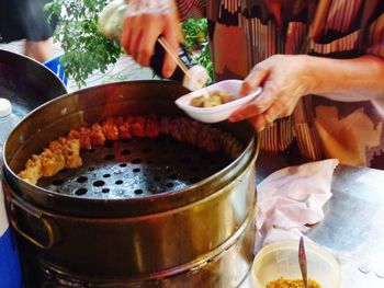 Midsection of man preparing food