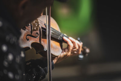 Close-up of hand playing guitar