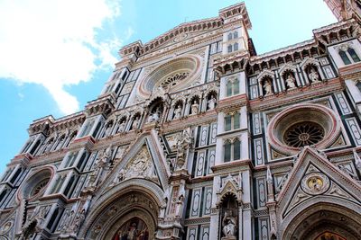 Low angle view of ornate building against sky