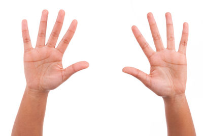 Close-up of human hand over white background