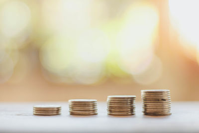 Close-up of stacked coins on table