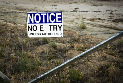 Information sign on fence