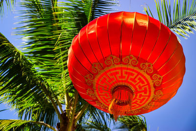 Low angle view of lantern against sky