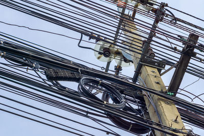 Low angle view of cables against clear sky