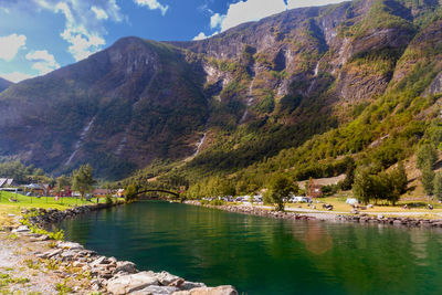 People camping where the magical green river meets the stunning mountains against sky