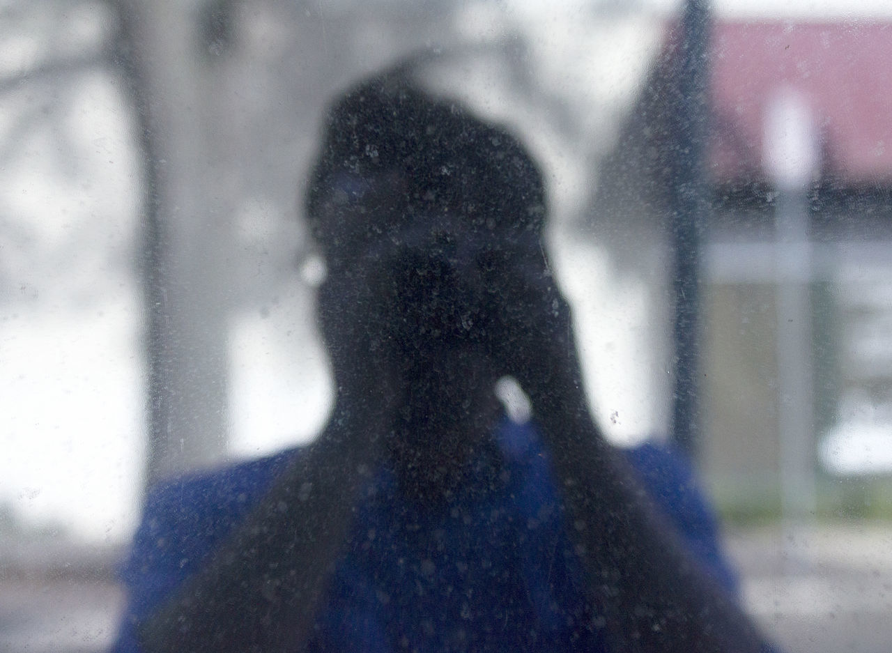 lifestyles, leisure activity, shadow, focus on shadow, standing, sunlight, person, men, indoors, focus on foreground, unrecognizable person, window, silhouette, street, day, wall - building feature, selective focus, defocused