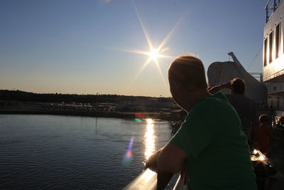 Sun shining over river
