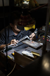 Portrait of man working on table