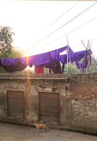 Clothes drying on wall against building