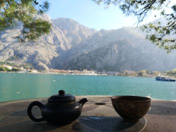 Scenic view of sea with mountains in background
