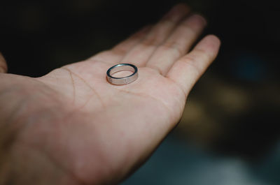 Close-up of hand holding finger