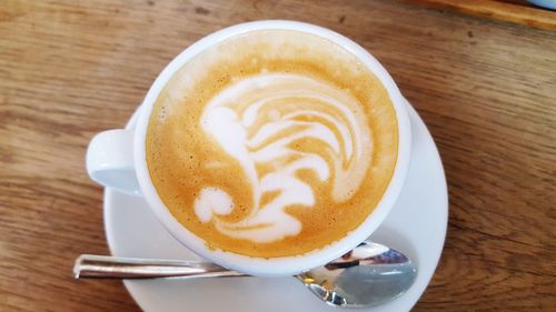 High angle view of cappuccino on table