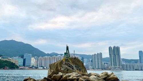 Panoramic view of buildings and city against sky