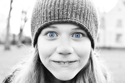 Close-up of smiling girl wearing knit hat